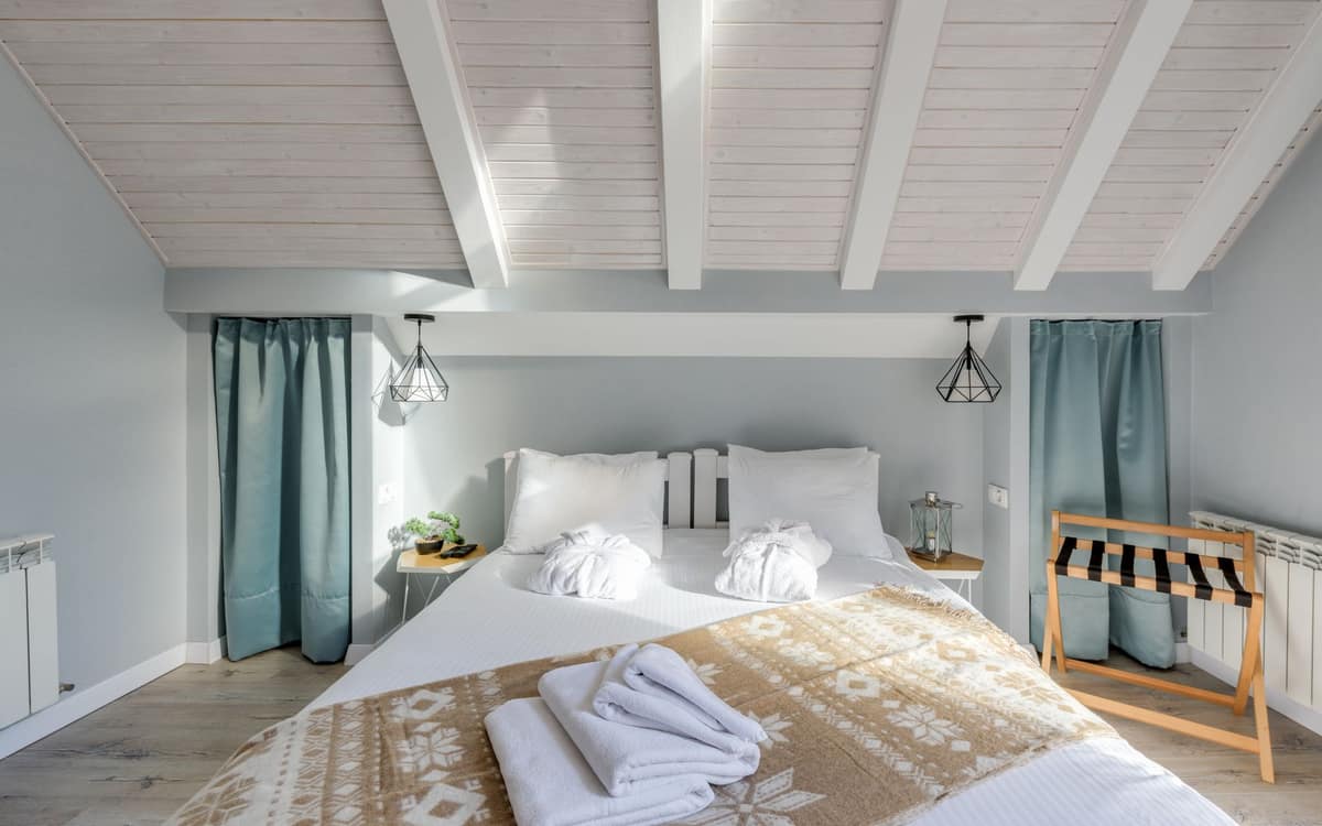 A folded lightweight duvet in a bedroom