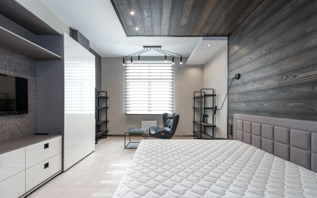 A mattress on a simple bed frame