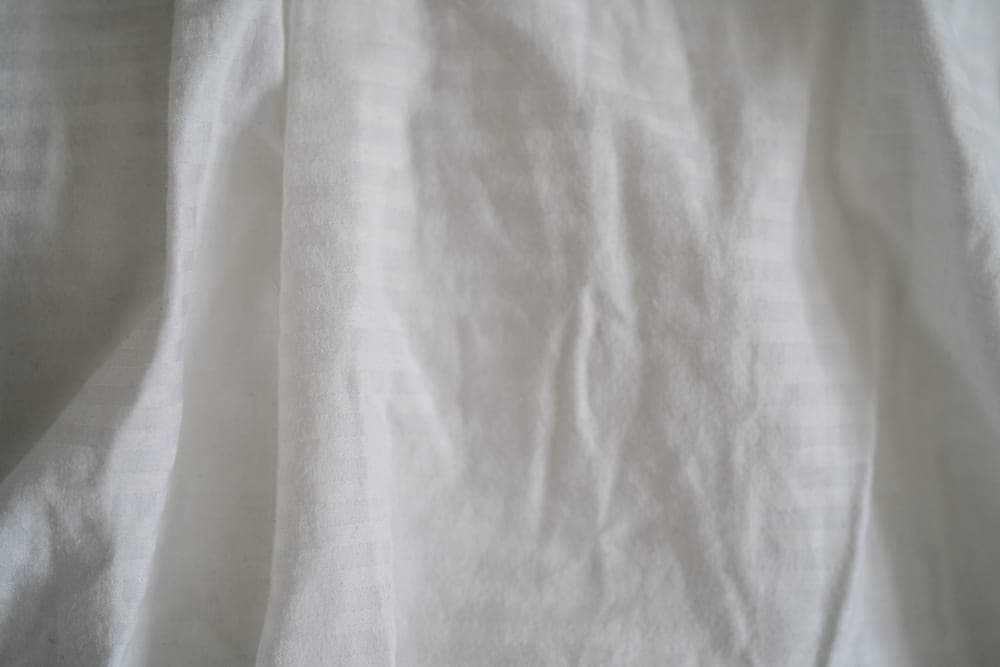 Detail of a white pillowcase fabric