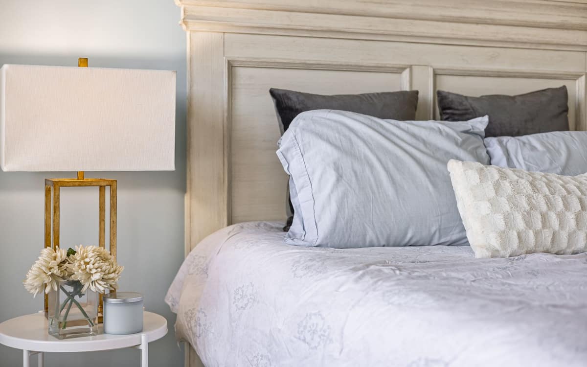 Bed pillows propped against a headboard