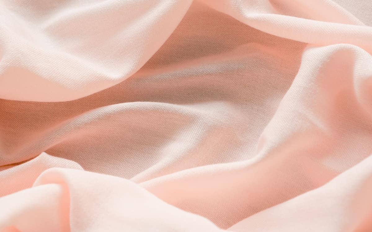Close-up of smooth, silky bedding fabric