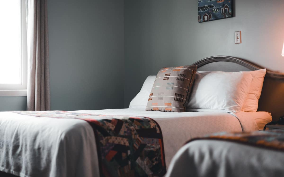 A large, neatly made bed for two